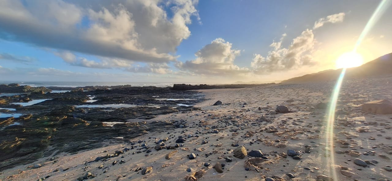 Long horizontal view of the nearby beach and sea