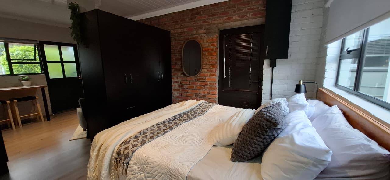 Bedroom view with the double bed and soft neutral styling